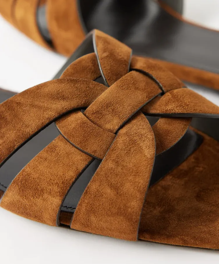 SAINT LAURENT
Tribute braided-strap suede sandals