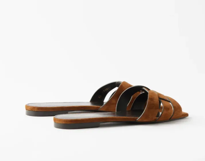 SAINT LAURENT
Tribute braided-strap suede sandals